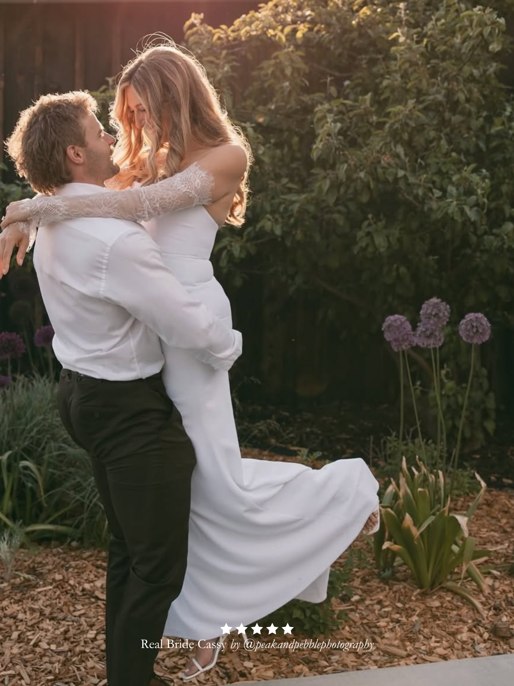 Man lifting a woman in a wedding dress and Harriett Falvey doubled edged lace gloves in a garden setting with greenery and flowers. And a five star review overlay.