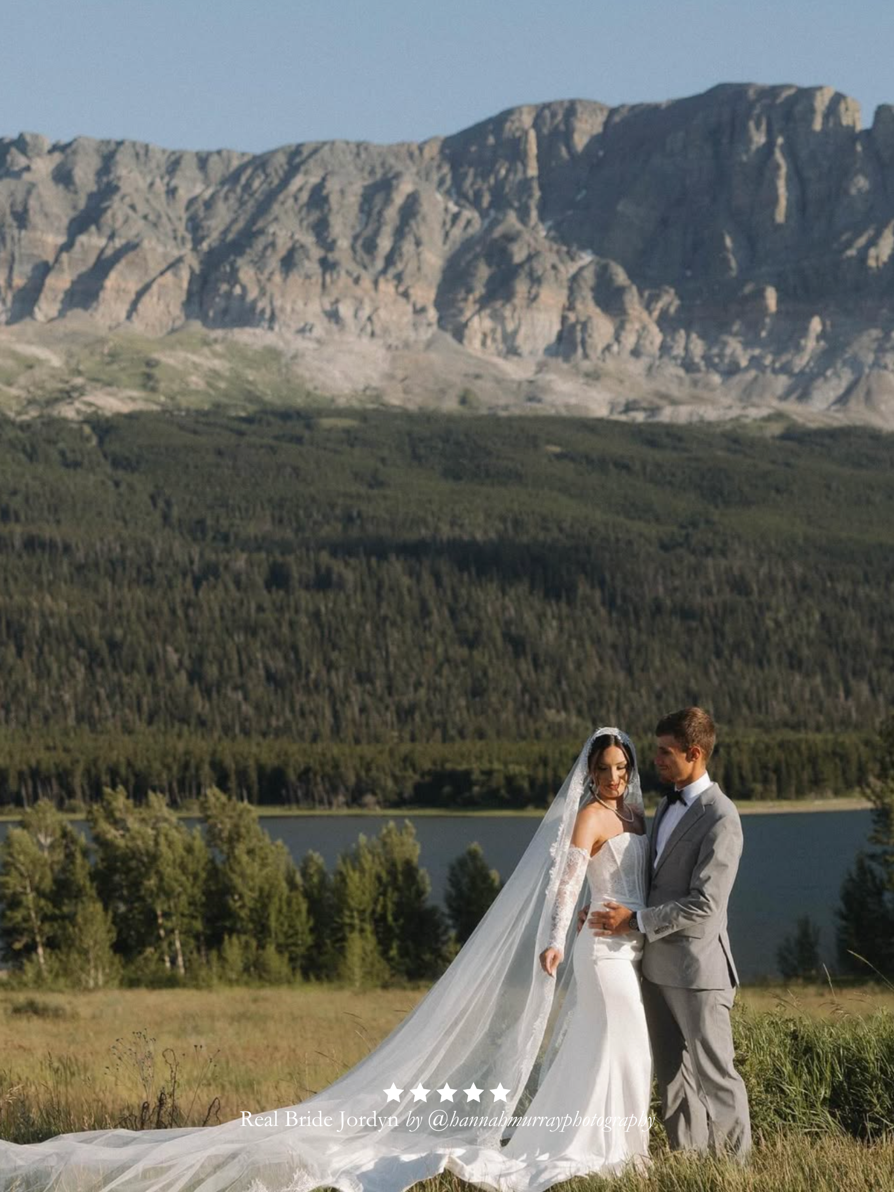 Couple in wedding attire standing in a scenic landscape with mountains and a lake. Real bride wearing her Harriett Falvey extra wide chantilly lace mantilla veil. With five star review overlay.