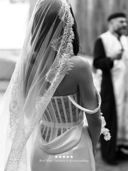 Black and white photo of real bride wearing her custom extra wide chantilly lace mantilla veil by Harriett Falvey.
