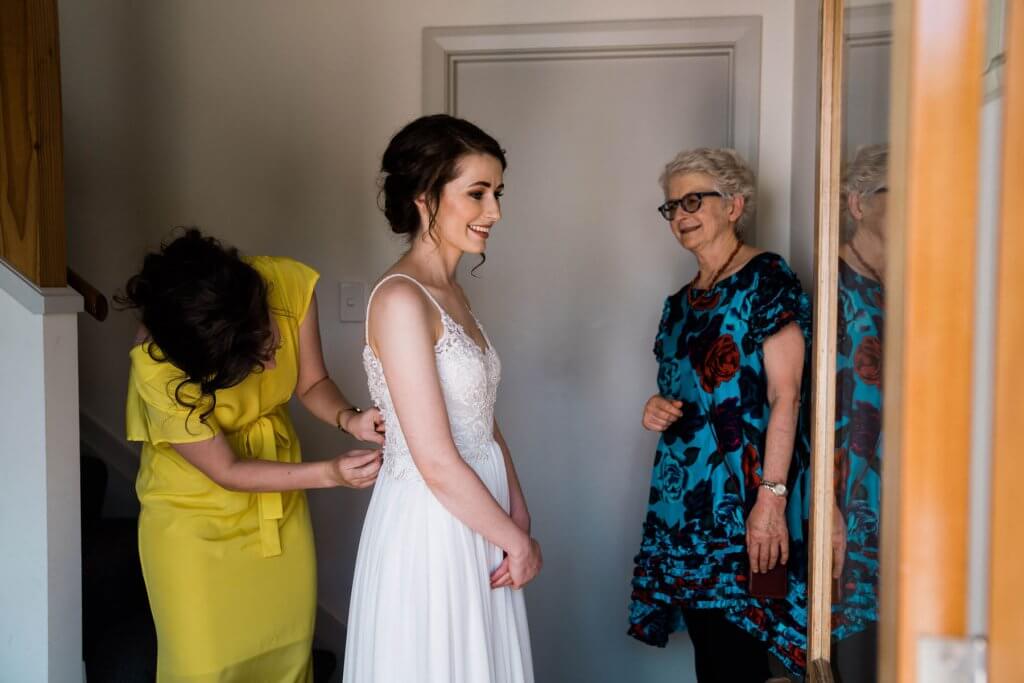 Real Bride Clare wearing her Custom Harriett Falvey Wedding Dress Made in New Zealand