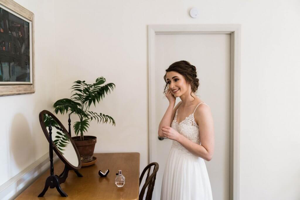 Real Bride Clare wearing her Custom Harriett Falvey Wedding Dress Made in New Zealand