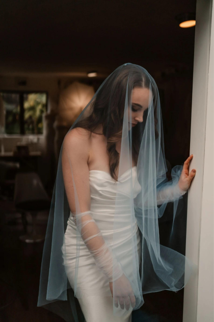 Model Styling the Blue Blusher Veil designed by Harriett Falvey, New Zealand Bridal Designer