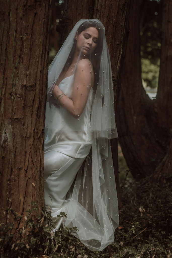 Model Styling the Pearl gathered blusher veil designed by Harriett Falvey, New Zealand Bridal Designer.