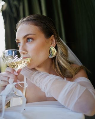 Styled shoot, model wearing a custom Harriett Falvey tulle wedding gloves. Photographed by @curate.weddings To see more head to our website