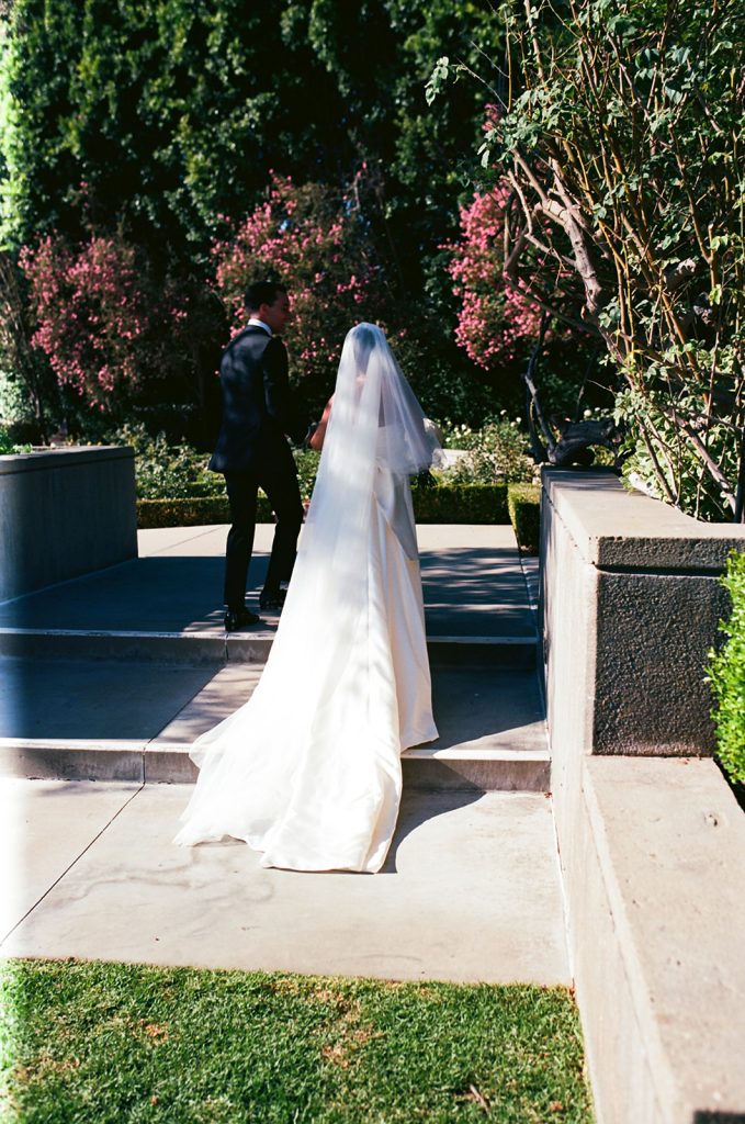 Real Bride Sara wearing her custom tulle blusher veil by Harriett Falvey | Custom Bridal Designer