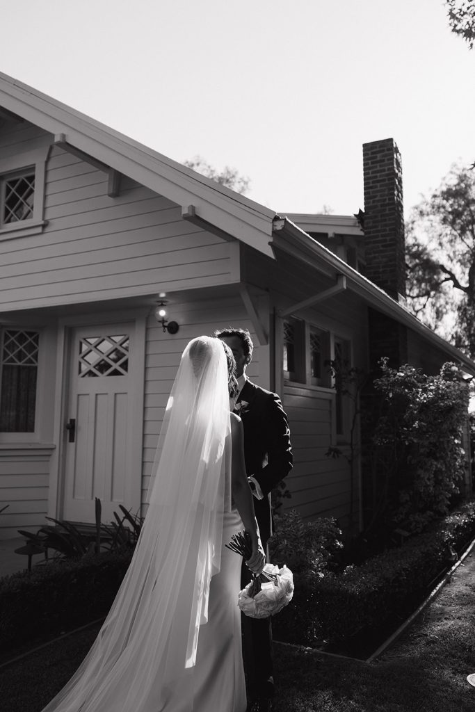 Real Bride Sara wearing her custom tulle blusher veil by Harriett Falvey | Custom Bridal Designer