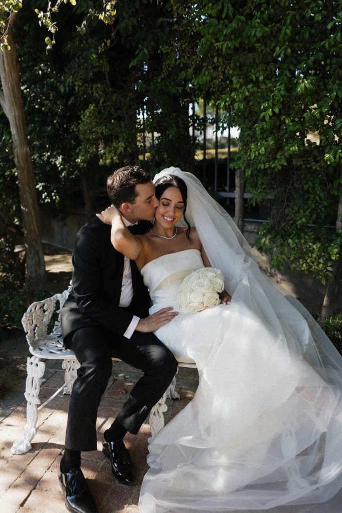 Real Bride Sara wearing her custom tulle blusher veil by Harriett Falvey | Custom Bridal Designer