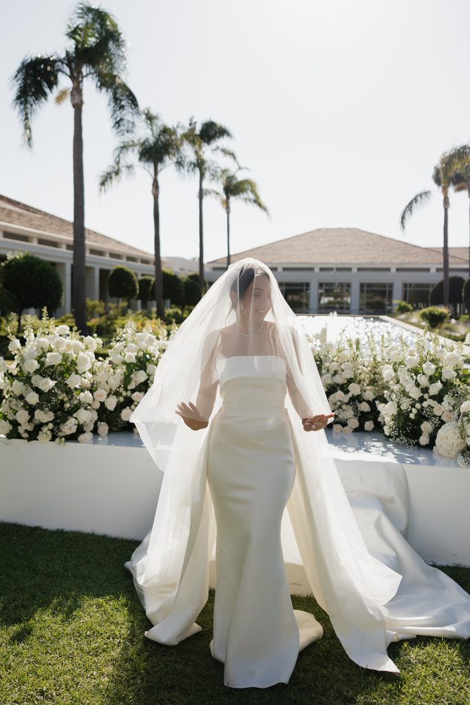 Real Bride Sara wearing her custom tulle blusher veil by Harriett Falvey | Custom Bridal Designer