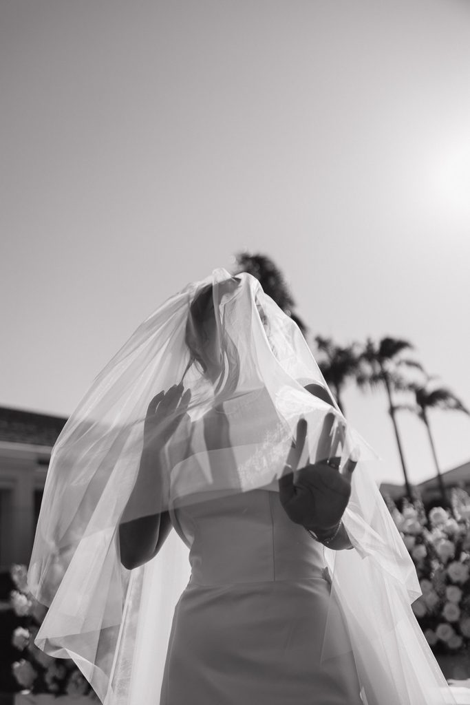 Real Bride Sara wearing her custom tulle blusher veil by Harriett Falvey | Custom Bridal Designer