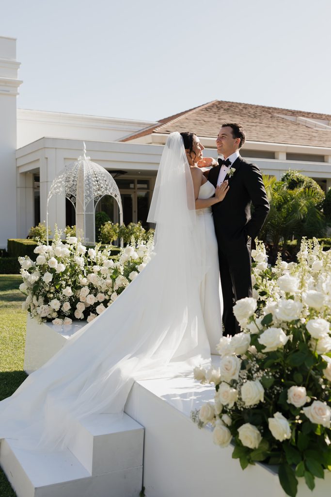 Real Bride Sara wearing her custom tulle blusher veil by Harriett Falvey | Custom Bridal Designer