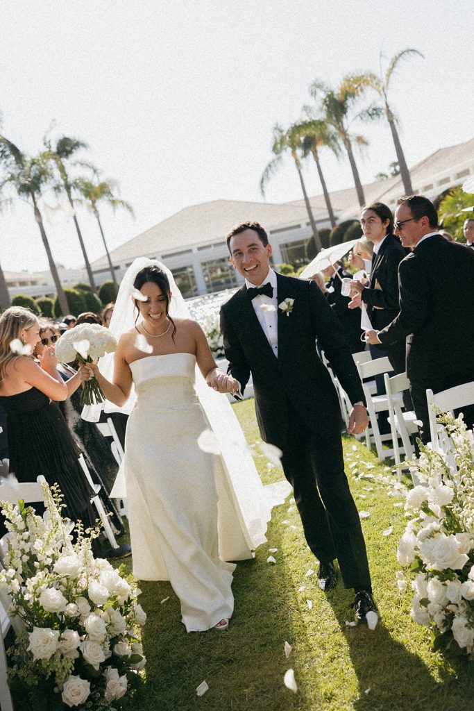 Real Bride Sara wearing her custom tulle blusher veil by Harriett Falvey | Custom Bridal Designer