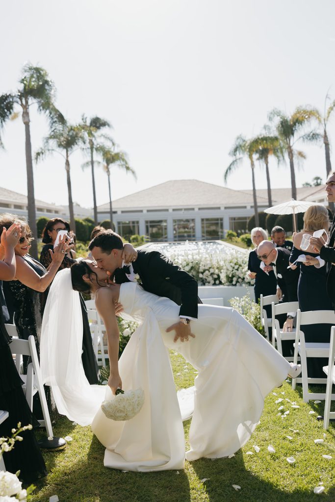 Real Bride Sara wearing her custom tulle blusher veil by Harriett Falvey | Custom Bridal Designer