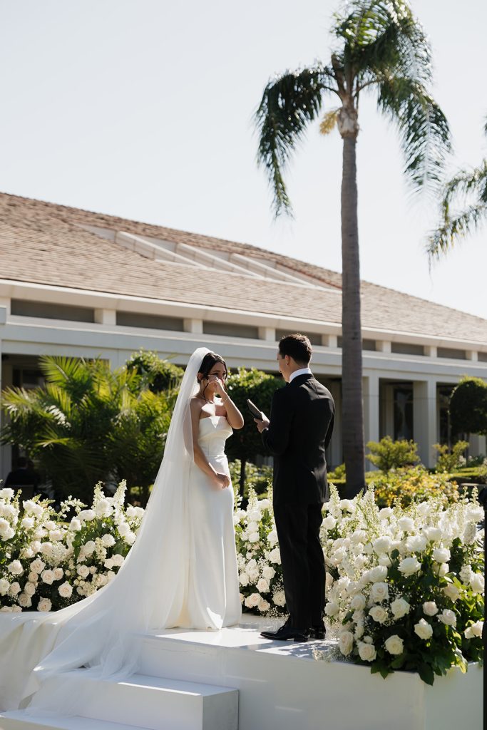 Real Bride Sara wearing her custom tulle blusher veil by Harriett Falvey | Custom Bridal Designer