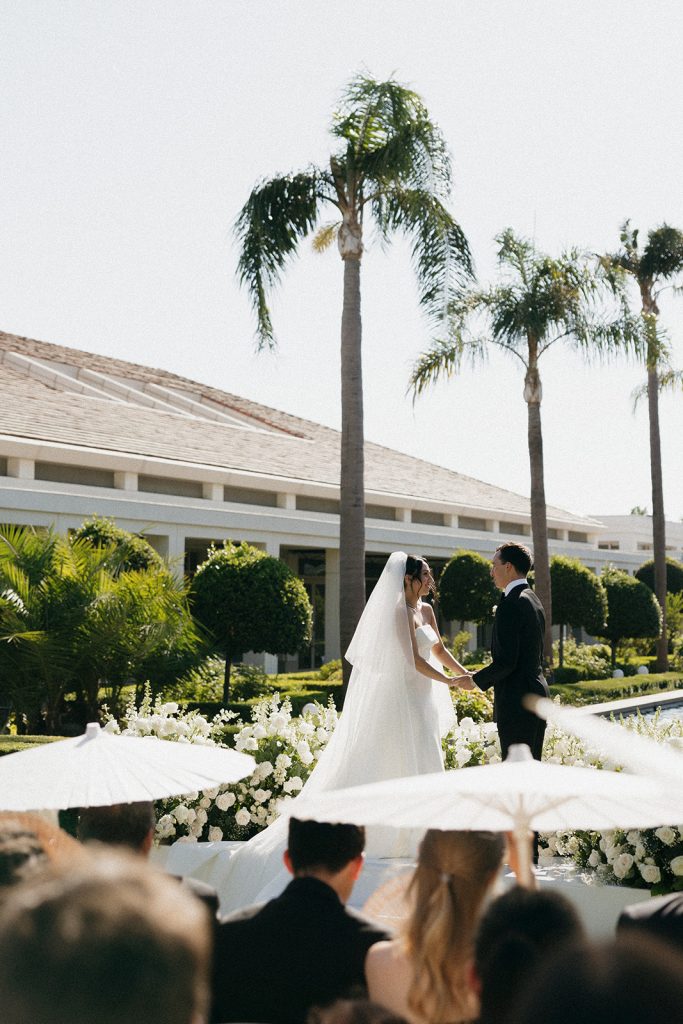 Real Bride Sara wearing her custom tulle blusher veil by Harriett Falvey | Custom Bridal Designer