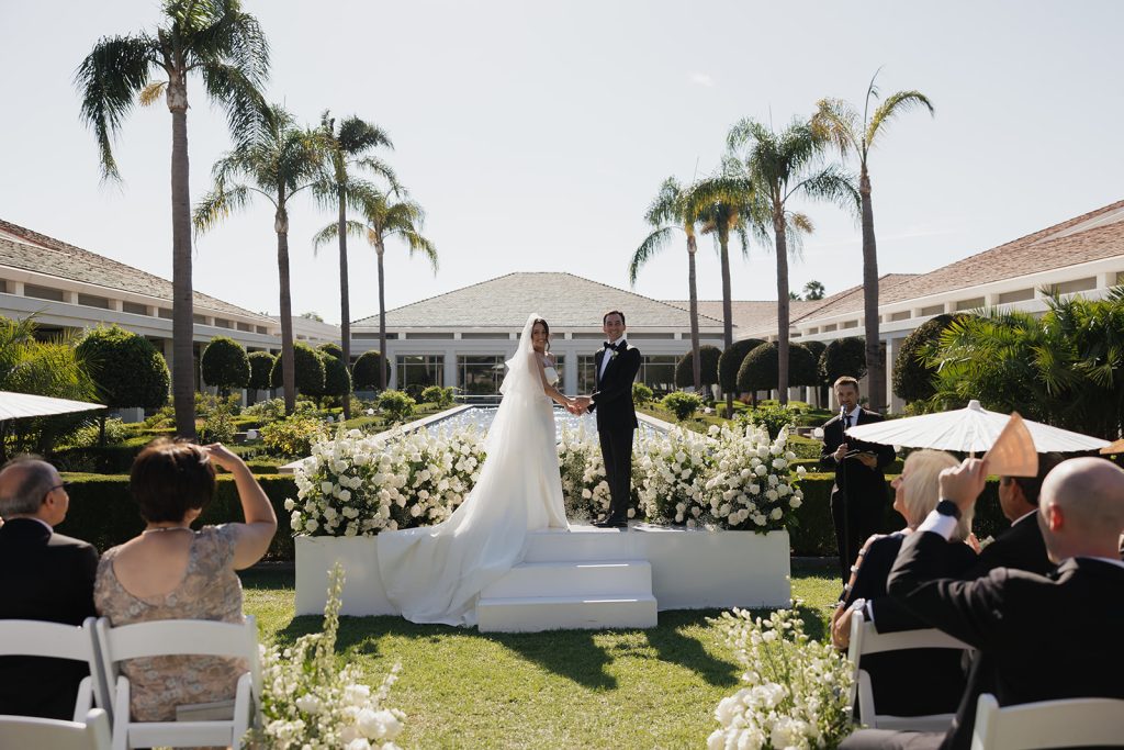 Real Bride Sara wearing her custom tulle blusher veil by Harriett Falvey | Custom Bridal Designer