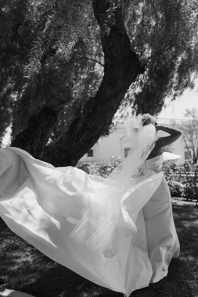 Real Bride Sara wearing her custom tulle blusher veil by Harriett Falvey | Custom Bridal Designer