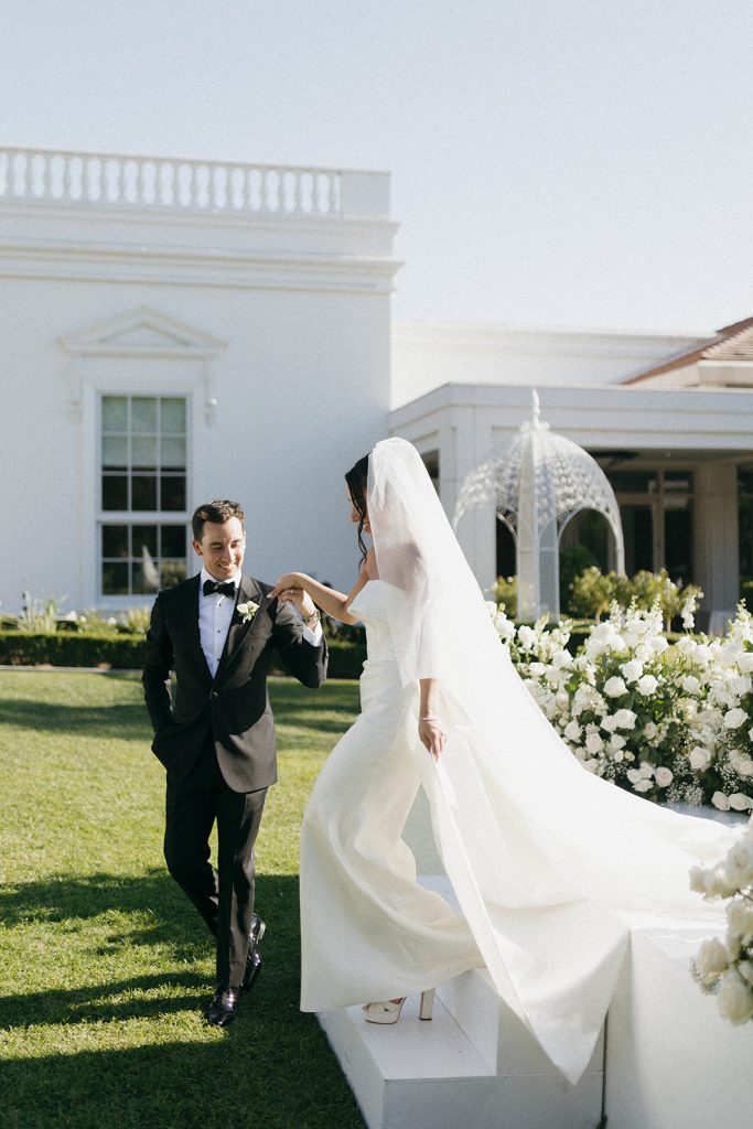 Real Bride Sara wearing her custom tulle blusher veil by Harriett Falvey | Custom Bridal Designer