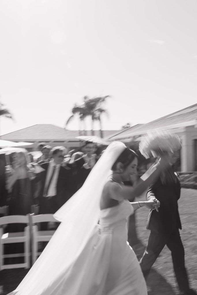 Real Bride Sara wearing her custom tulle blusher veil by Harriett Falvey | Custom Bridal Designer