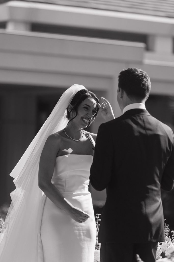 Real Bride Sara wearing her custom tulle blusher veil by Harriett Falvey | Custom Bridal Designer