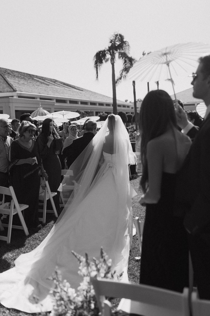 Real Bride Sara wearing her custom tulle blusher veil by Harriett Falvey | Custom Bridal Designer