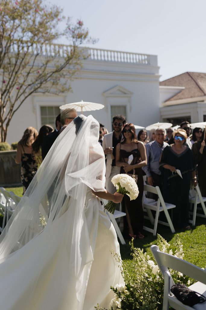 Real Bride Sara wearing her custom tulle blusher veil by Harriett Falvey | Custom Bridal Designer