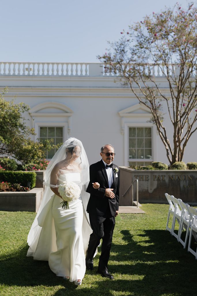 Real Bride Sara wearing her custom tulle blusher veil by Harriett Falvey | Custom Bridal Designer