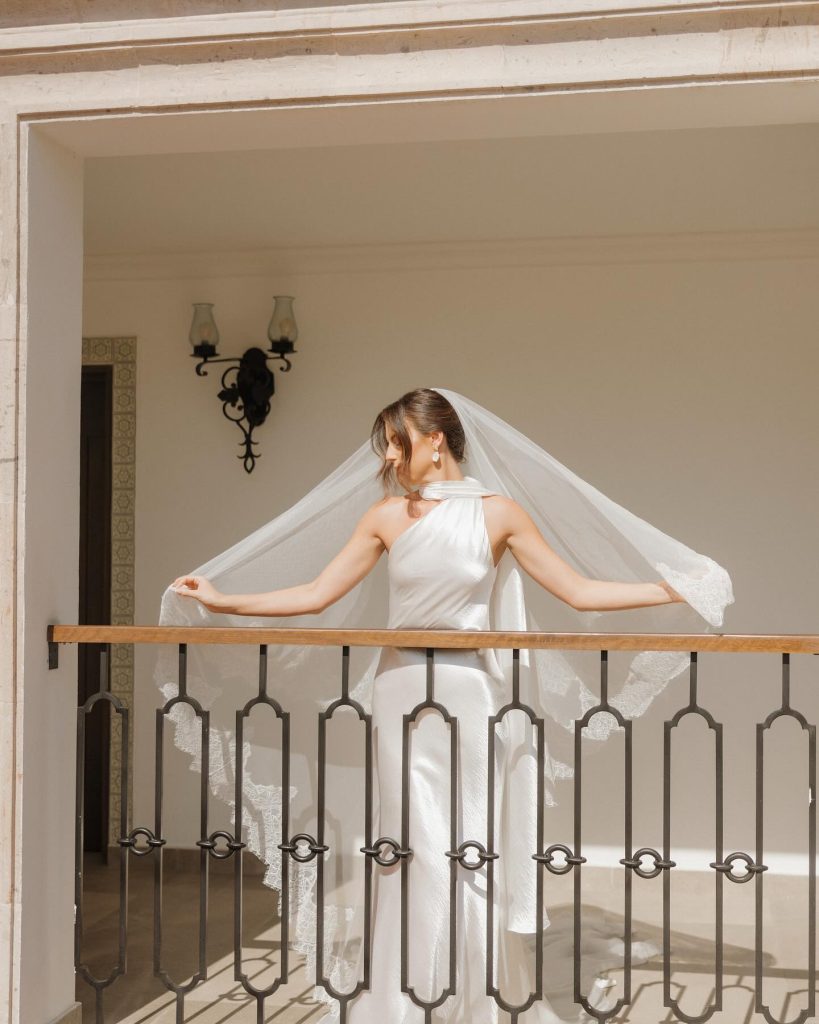 Real Bride Olivia wearing her custom Harriett Falvey Lace edged blusher veil to her wedding in Mexico