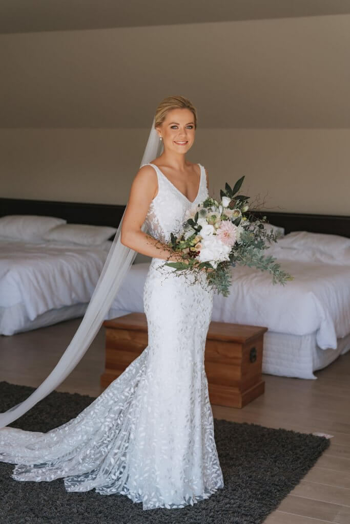 Real Bride Tammy wearing her Custom Harriett Falvey Wedding Dress and Veil Made in New Zealand