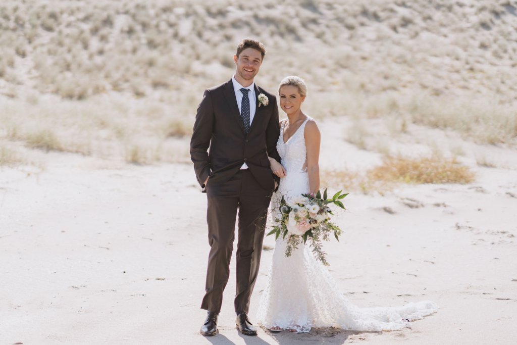 Real Bride Tammy wearing her Custom Harriett Falvey Wedding Dress and Veil Made in New Zealand